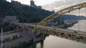 Aerial: Rush hour traffic on the Fort Pitt Bridge that crosses the Monongahela River. Pittsburgh, Pennsylvania, USA