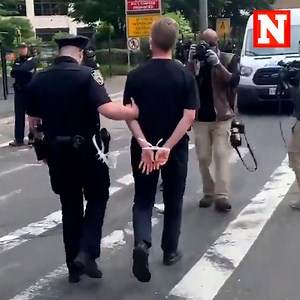 Video shows police arrested New York City mayoral candidate Shaun Donovan during a demonstration in New York City marking the first anniversary of the death of George Floyd. Donovan joined a group that blocked traffic near the Holland Tunnel in protest. Thumb credit: Jeremy Edwards/Storyful | Newsweek