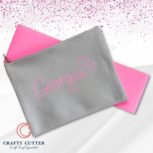 How do you personalise cosmetic bags or similar with names? Our HTV Strips are a great way to accomplish this for a fraction of the price of A4 sheets.. Plus we have plenty of colours to choose from 拾 #cricut #cricutmade #cricutmaker #cricutcrafts #smallbusiness #handmade #diy #vinyl #cricutcreations #etsy #svg #cricutexploreair #crafts #silhouettecameo #craft #custom #custommade | Crafty Cutter Limited | Facebook