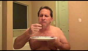 tom pearl stuffs his mouth with shit