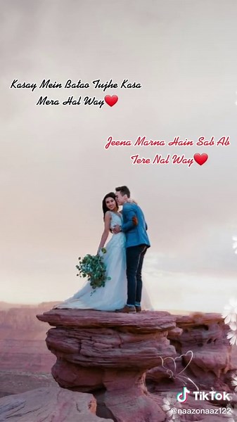 Romantic Cosplay Couple Embraces on Scenic Cliff