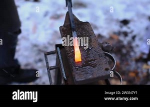 Indian woman hitting on stone with hammer