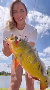 Lauren Lila with a nice peacock bass caught on the DOA Grub. DOALures.com | DOA Lures