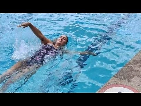 Girl swims 50m freestyle back and front in outdoor pool - VLOGMAS DAY 7