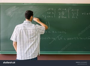 Teacher Erasing Math Formulas On Chalkboard Stock Photo 2215526675 | Shutterstock