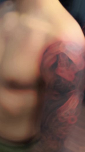 Striking Upper Arm Tattoo with Warrior Design