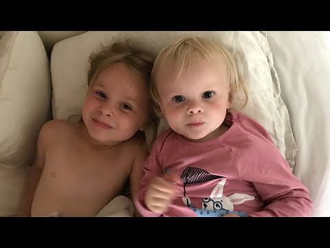 Kids playing in bed