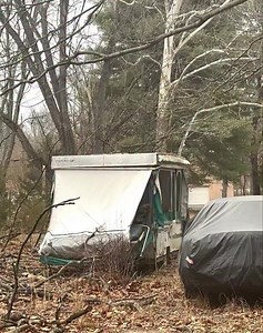 I think Trapper John “stayed over” last night! Yesterday, we were expecting a nasty ice storm. When I saw Trapper yesterday morning, I gave him double his usual wet food in case he couldn’t come back due to heavy sleet last night. Around 3:00 yesterday afternoon, I went out to put food in his station before the sleet started. That’s when I saw him come out of my cousin’s old camper next door, the same camper Shadow sometimes used. He sat there playing the entire time I was feeding him, which mea