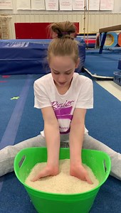 Since we can’t swing on bars, we have to do something to keep our wrists and forearms strong! Try these rice exercises! You can you sand or beans too. Playing with play doh, silly putty, and slime can keep your grip strength up too! | Cincinnati Gym