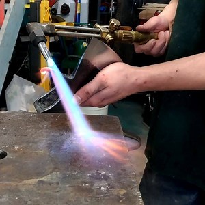 1.4K views · 66 reactions | Bending the spike on this Russian topor axe in a safe direction.  Using the oxy-propane torch to heat it up and my @faramforge straight peen to do the bending. The hammer is a joy to use  Paul Krzyszkowski TorontoBlacksmith.com #axe #forged #steel #blacksmith #torch #hot #fire #welder # | Toronto Blacksmith - By Paul Krzyszkowski | Facebook