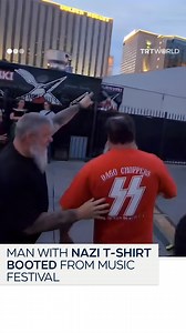 A man wearing a Nazi T-shirt with a large "SS" logo, was forced out of the Punk Rock Bowling festival in Las Vegas, Nevada by other attendees. Festival goers pushed and shoved the man towards the exit while yelling, "Get this Nazi out" | TRT World
