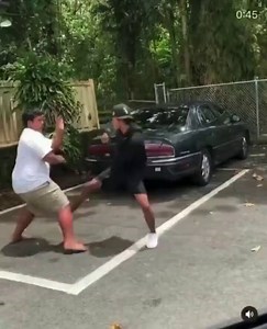 this fight between two asian students. the skinny one tried to take the fat guy but weight matters until fat guy moms came to put stop to it