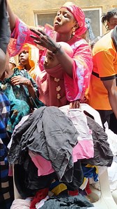 Our NGO Women of intercession initiative sharing three bales of clothes to the needy | Minister Ngozi Udogaranya | Facebook