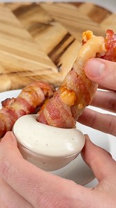 4M views · 39K reactions | Bacon Wrapped Cheesy Pickles 襤 What you need: 1 cheese stick, frozen 1 slice of bacon 1 pickle spear / halve How to make them: 1. Hollow out your pickle as much as you can, add the frozen cheese stick & wrap with bacon. 2. Air fry @ 400F for 6-8 mins. Take them out, serve with ranch and enjoy! | Keto Snackz | Facebook