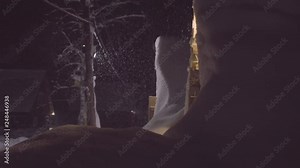 Panoramic view of the skitouring lodge in the night. Snowfall, Siberia.