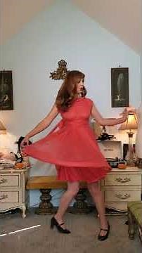 Dainty Rascal dancing in vintage red dress