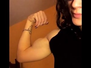Young Muscle Girl Flex Biceps