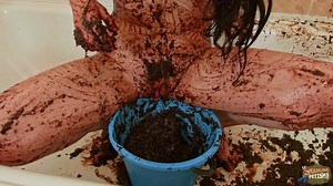 Lady masturbates with shit bucket