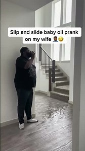 Wife slips on baby oil prank!