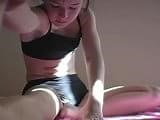 Teen Stretching In Sports Bra