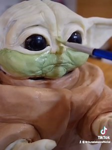 I made this hyper realistic Baby Yoda cake from chocolate cake and vanilla icing. Watch me slice it up at the end. 😱 | Lara Cakes