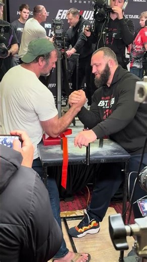 Dzeranov and Devon mess around outside of straps. East vs West 21 afterpull