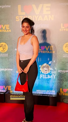 2.5K views | #IshaTalwar looks beautiful in a purple  tank top and a black  pair of jeans with a red ❤️ tote bag as she flashes a sparkling smile  and is spotted  at the movie screening of #LoveStoriyaan  She’s a vision of pure elegance.  #ishatalwarhot #ishatalwar #ishatalwarfans | Take One Filmy | Facebook