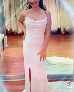 Posh and timeless, this modern wedding dress is created with the minimal bride in mind. ‍♀️ A draping neckline is unique and lavishly romantic, supported by simple beaded spaghetti strap while the back of the gown opens up to show off the lower back! This dress=perfection! #laurasbridal #simpleweddingdress #bridalshopping #elegantweddingdress #fittedweddingdress #openbackweddingdress #classyweddingdress #weddingdresseswithsleeves #weddingdresseswithpockets | Laura's Bridal | Facebook