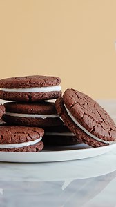 HOMEMADE OREOS! This recipe is even better than the store bought cookies and surprisingly easy to make! All I need now is a big a glass of milk 🥛 Oreos are my favorite box snack, what is yours? Follow @weelicious for more delicious and fun recipes ☀️ https://weelicious.com/oreo-cookies-yes-you-can-make-them-at-home/ | weelicious