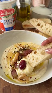 The easiest dip to throw together: Whipped Ricotta Galbani Cheese Easy Home Meals #ad The garnishes really can be whatever you want. I went with roasted grapes and garlic confit. Galbani Ricotta is whipped until it’s creamy and airy and layered with olive oil, grapes, garlic, and red pepper flake. Serve with focaccia.Ingredients:1 cup Galbani Ricotta Cheese, 1 tablespoon extra-virgin olive oil1/2 teaspoon sea salt pepper1 tablespoon honey, Added garlic confit, roasted grapes (salt pepper, thyme)