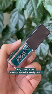 A green lip gloss, that turns pink, gives your lips a custom hue and can also be used as a cheek tint? 😲 💯 You heard that right! 💖 The new PH lip gloss by Nykaa Cosmetics is definitely the coolest addition for your collection. 💯 Click on the link and get your hands on it now! ✨- https://nykaa.onelink.me/GjoF/u8ra5d63 #Nykaa #LipGloss #Lipstick #Lipoil #Liplook | Nykaa