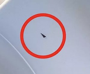 What Are Those Triangle Stickers Above Your Airplane Seat