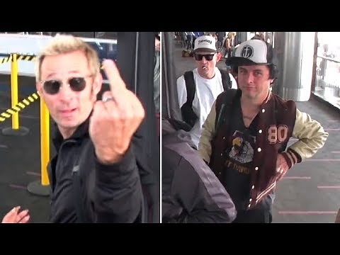 See How Green Day Bassist Mike Dirnt Reacts When They Get Papparazi'd At LAX