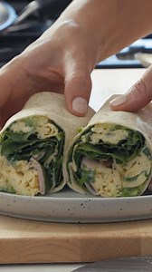 Filled with fluffy spring onion scrambled eggs, ham and all the classic trimmings, these burritos made with 10 inch LaBanderita Tortillas flour tortillas are perfect for breakfast, brunch or lunch. 🌯 | Justine Schofield