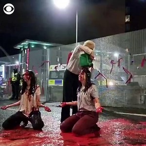 Protesters staged a “blood bath” outside the entrance of the COP26 Climate Summit in Glasgow, Scotland, which was in its final day on Friday. Multiple activist groups have criticized the lack of results from the summit as world leaders finished their talks. | CBS News