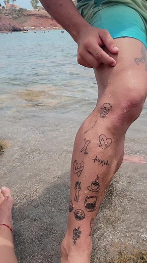 Unique Beach Tattoos Showcase: Leg Art in Focus