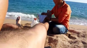 Older Asian bitch massages a guy's hairy legs admiring his big cock