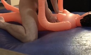 Pounding cheap female inflatable doll on blue waterbed mattress