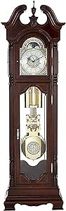 Howard Miller Polk Grandfather Clock, Swan Neck Pediment Illuminated Glass Case Mahogany Finish, Cast Corners with Brass-Finished Dial & Dual-Chime Movement Ideal for Office & Home Decor