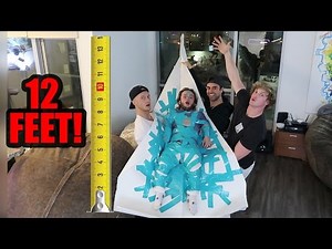 DWARF ATTACHED TO 12-FOOT PAPER AIRPLANE! (will it fly!?)