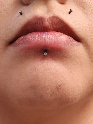 Freehand Labret Piercing with a cute prong CZ jewelry top. Link in the bio to schedule . . . #labret #lippiercing #oralpiercing #piercingsinorange | Piercings and Tattoos in Santa Ana by Scarlett