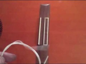 How to put strings on a classical guitar - a close up
