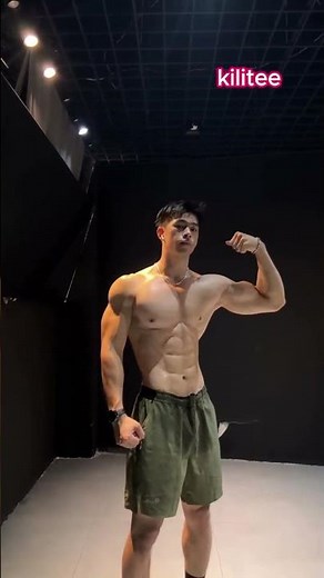 Shirtless guy flexing in the dark, sweat glistening on his 6-pack abs 💪🔥 #kilitee