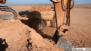 Caterpillar 5130B loading Komatsu HD785 and Hitachi EH1100 | Alat Berat Mania