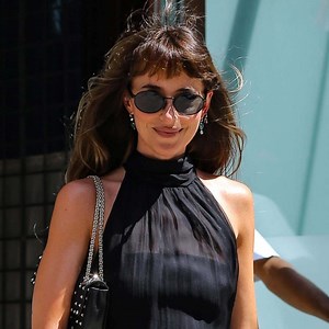Dakota Johnson is all legs in thigh-split dress at Taylor Swift and Travis Kelce's wedding