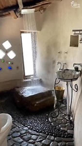 Heaven is a hot water shower especially when it’s in a natural mud bathroom with lime plaster and floor made of stones you collected yourself from your land. #naturalbuilding #cobhome #mudhouse #sustainablebuilding | Geeli Mitti