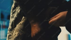 Man removing handcuffs from soldier's hands, released from military custody