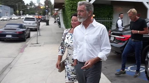 Pierce Brosnan looks dapper out with his wife in Los Angeles
