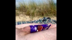 Nude beach fun - hung, horny and covering my big cock with a Cadbury’s ice cream wrapper