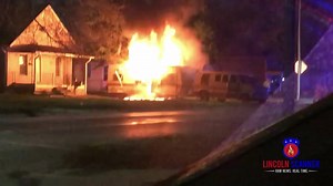 Structure Fire: 2311 S 9th Street Engine 3 on location of a working fire before dispatch could verify. Mobile home against a house fully-involved. LFR: B1 B2 E3 E13 E8 T1 T8 M8 A14 TAC: 4 Water on the fire. Primary search complete. The house against the mobile home is vacant. Power line down on the D-side. LES requested. Fire under control at 21:26. | Lincoln Scanner